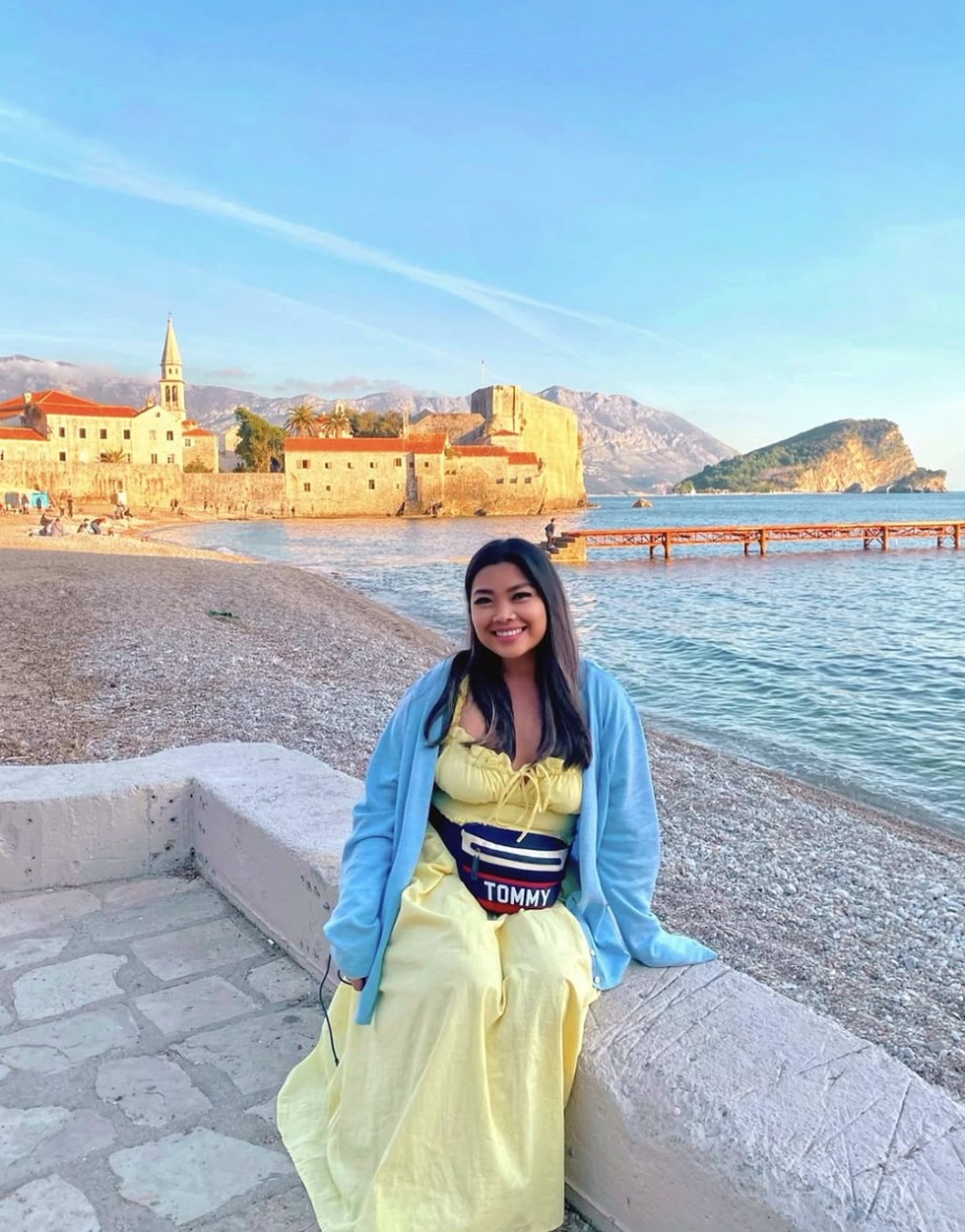 Jhayde sitting by the beach in front of Budva old town, Montenegro