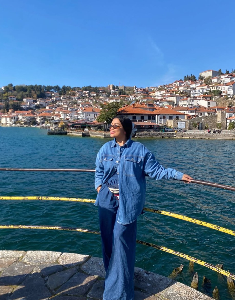 Jhayde in denim beside Lake Ohrid in North Macedonia